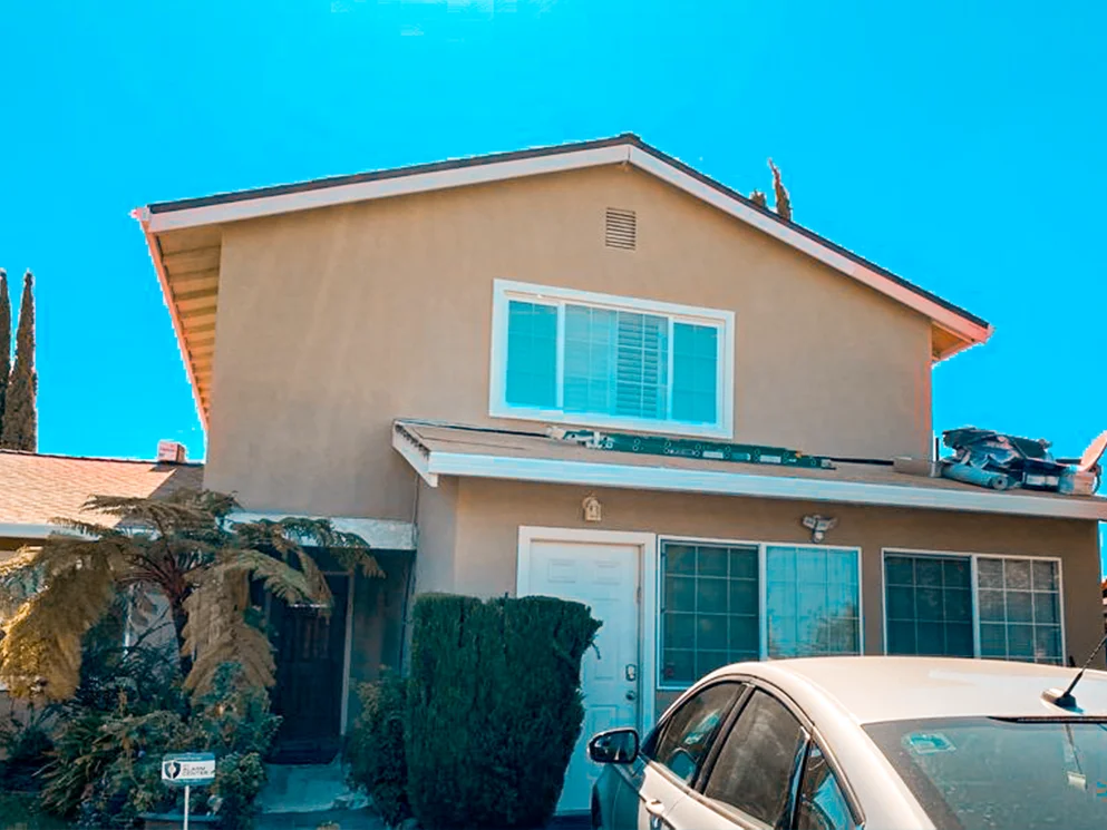 Front of the home with the new tan smooth acrylic stucco finish