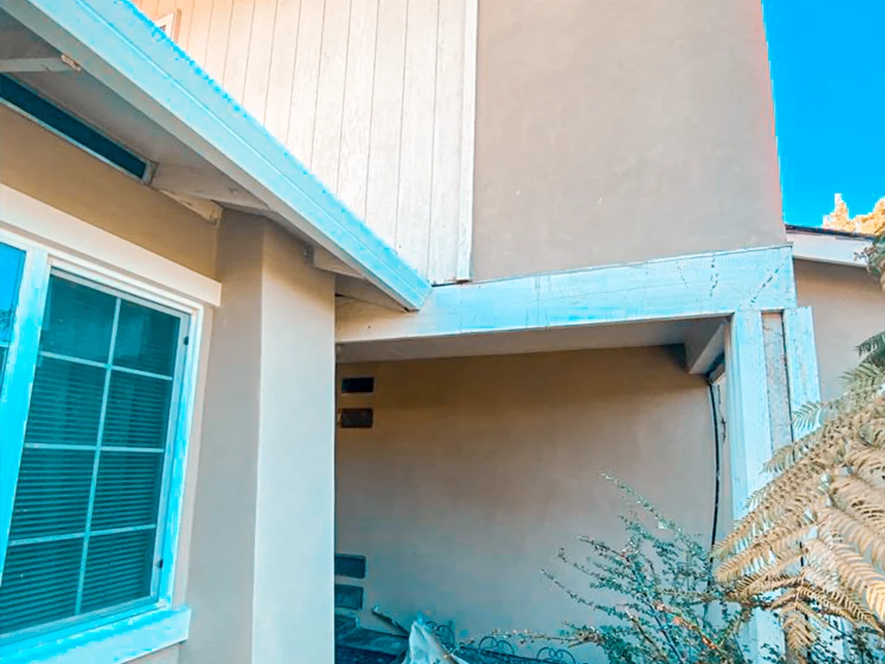Entry overhang and walls with the new smooth stucco finish