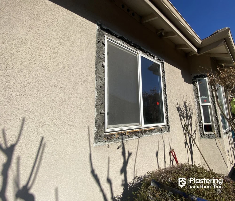 Sliding window set in a stucco wall opened for patch back