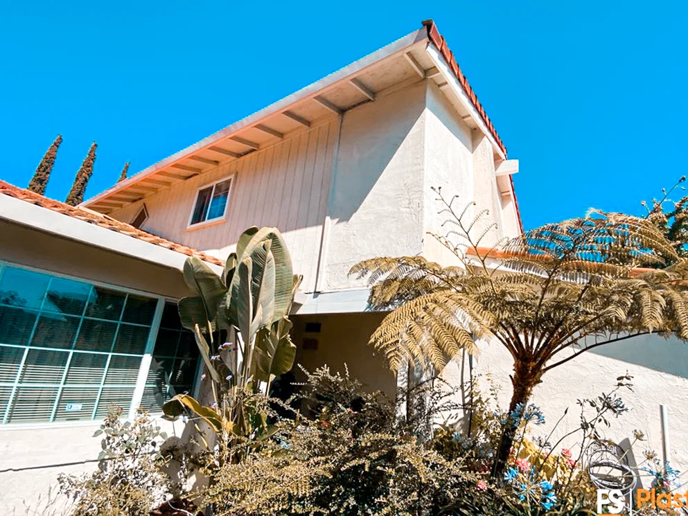 Completed smooth acrylic stucco finish on a two story San Jose home with a tile roof