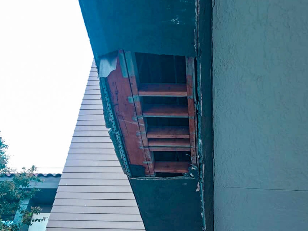 Open framing where the canopy beam met the building wall