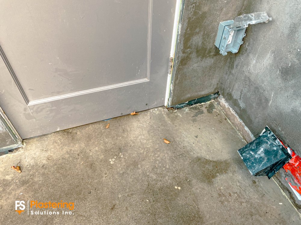 Lower wall at a door corner prepared ahead of the finish coat