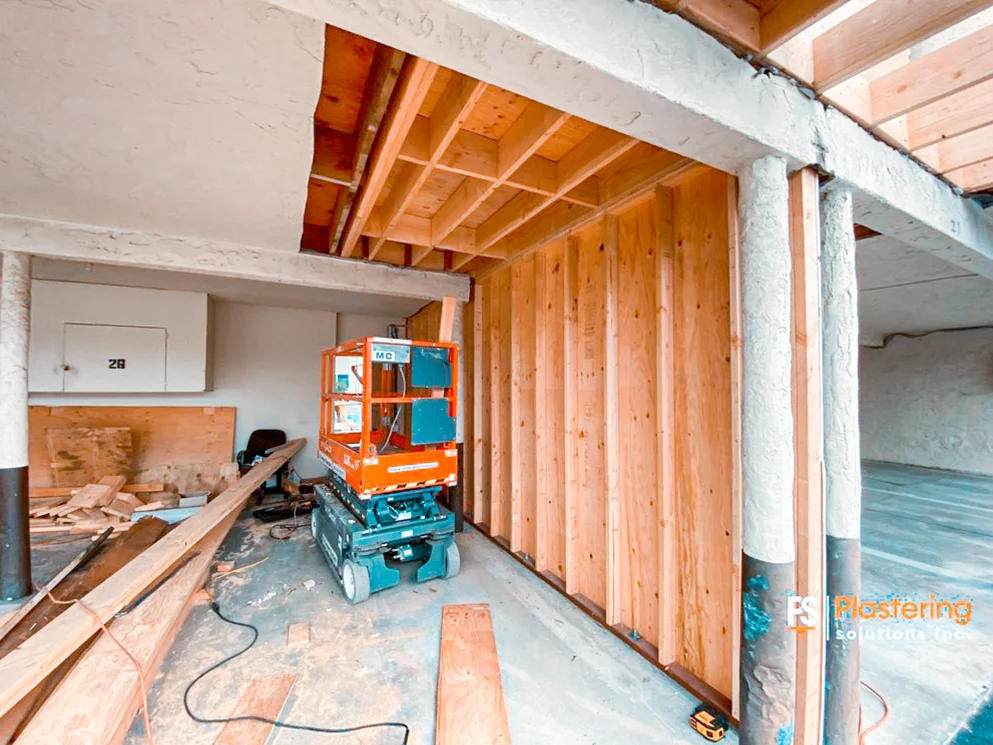 Plywood sheathing installed on a repaired apartment carport wall