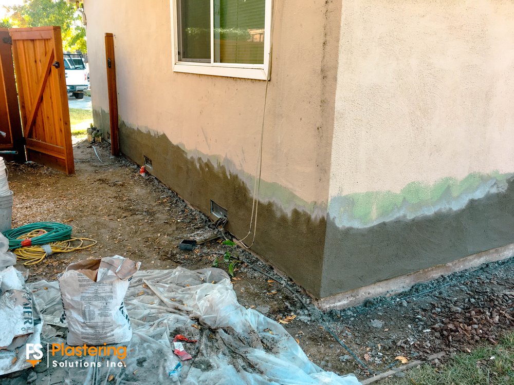 Base coat applied along the lower walls with the side yard protected