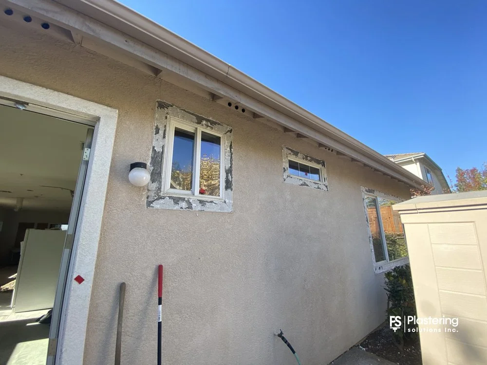 Side wall with primed patches around replacement windows