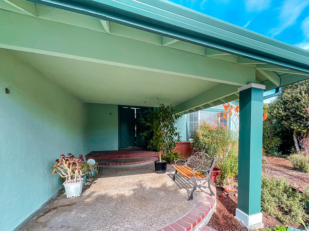 Finished stucco on the covered porch with a new green color