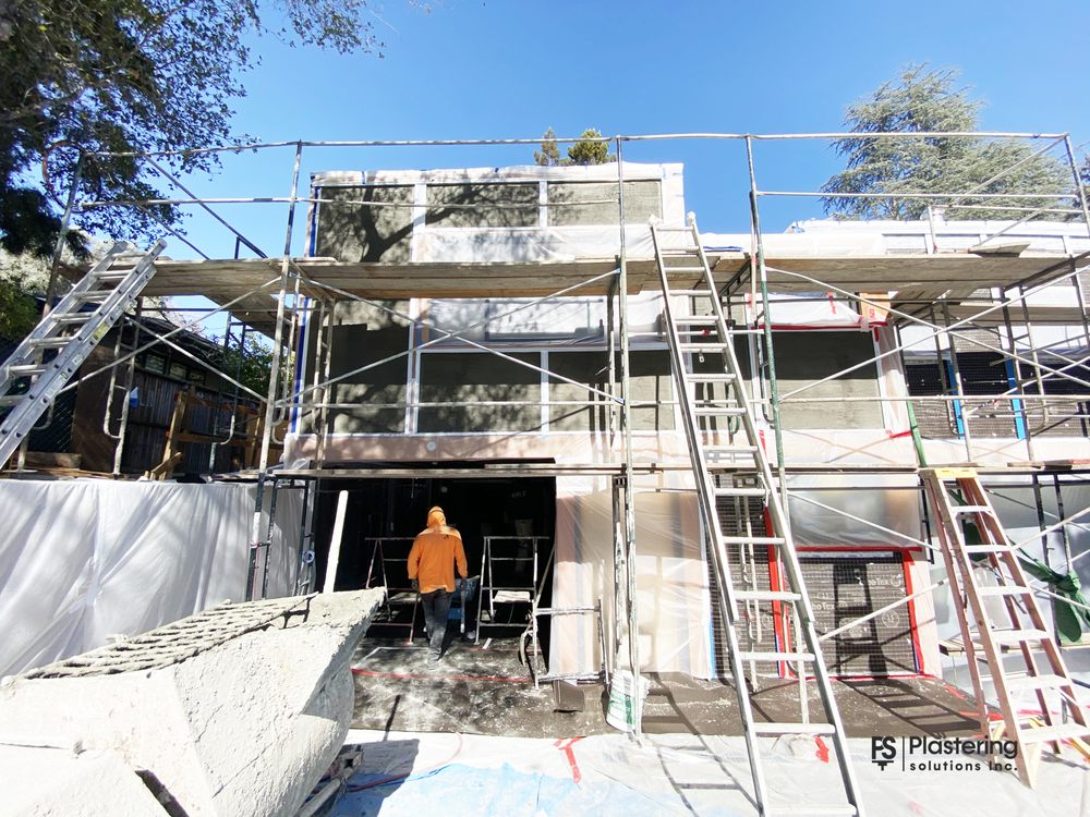 PSI crew member on full height scaffolding during a whole house exterior remodel in San Jose