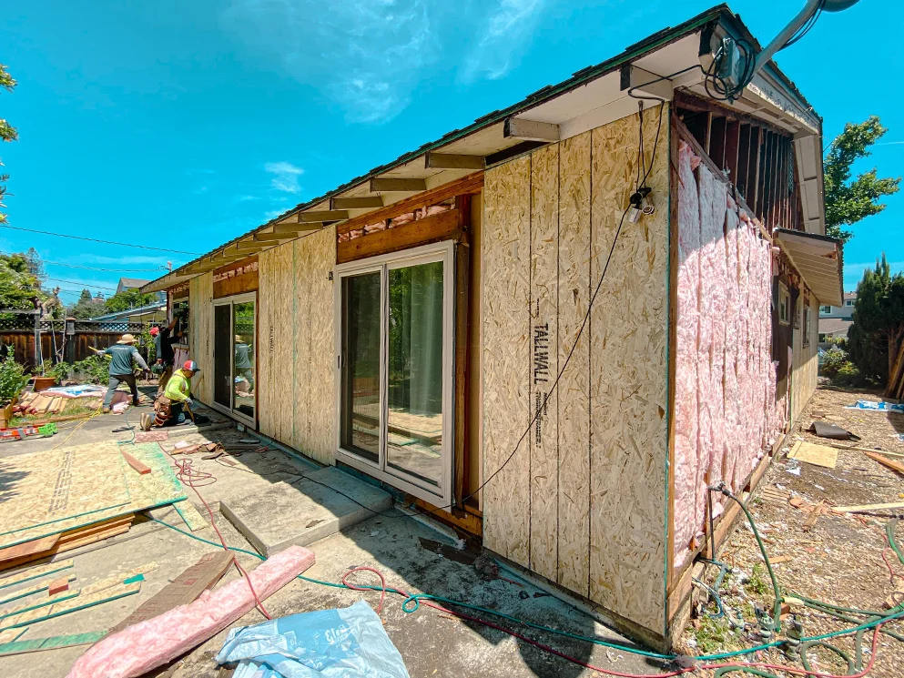 Rear of the home with new sheathing around the sliding doors