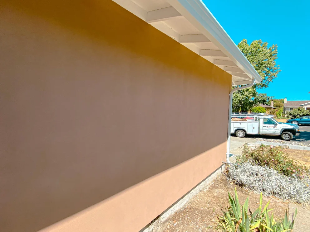 Finished acrylic smooth stucco along the front wall