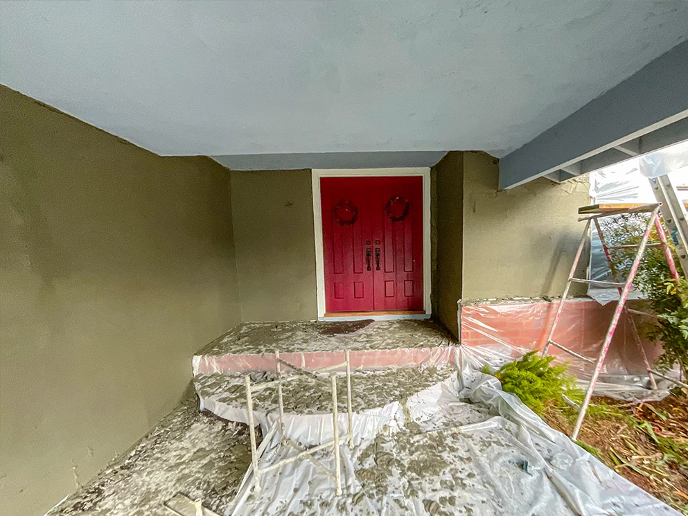 Covered entry with the scratch coat applied and the steps protected