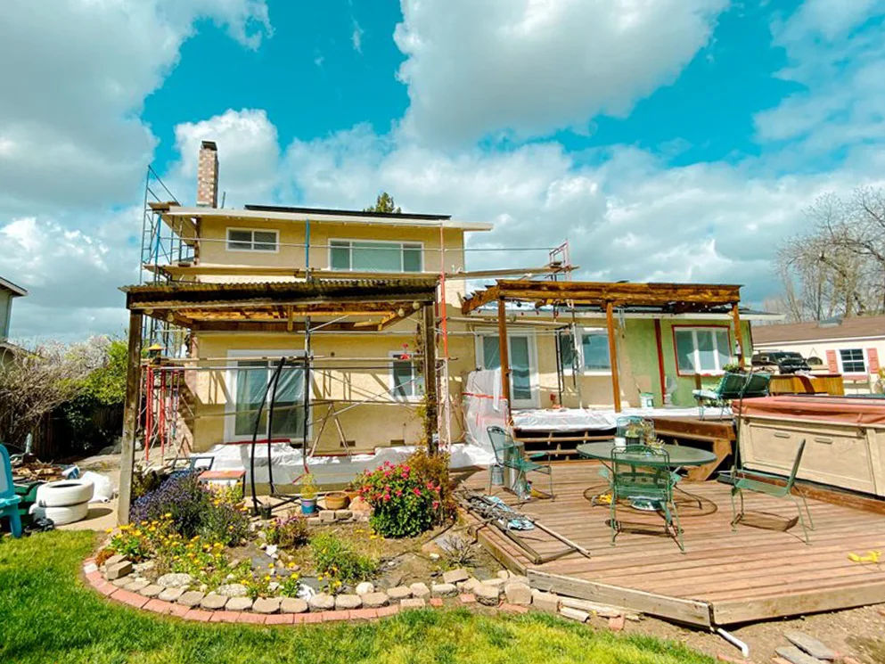 Scaffolding set around the home before stucco resurfacing