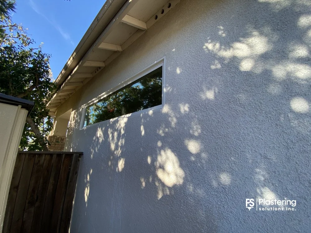 Completed wide window with the patch blended into the existing stucco