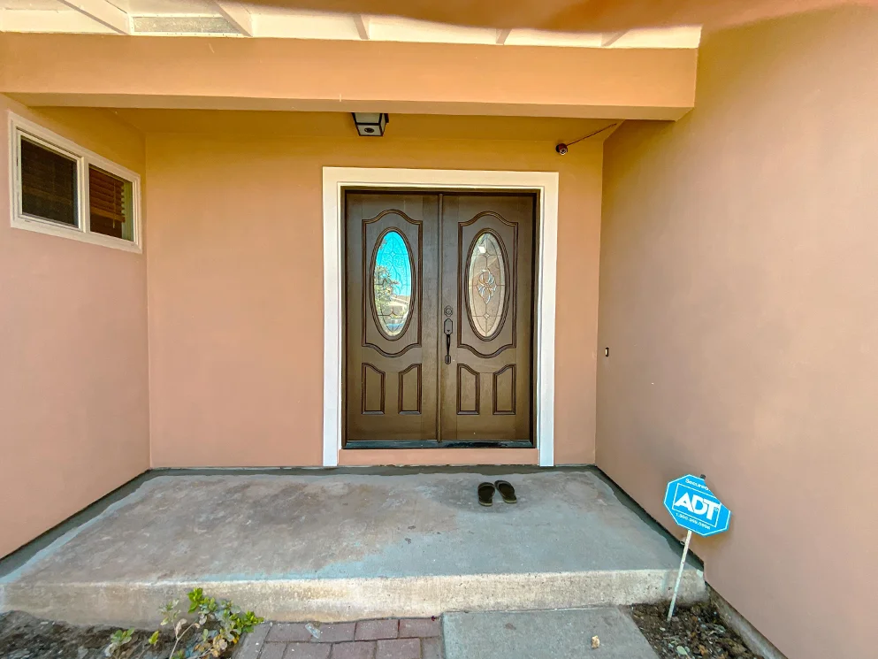 Front entry with the completed acrylic smooth stucco finish