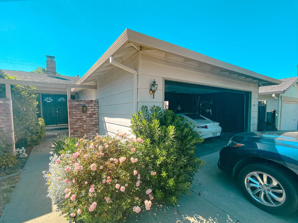 Front of the home with the original horizontal siding before the stucco conversion