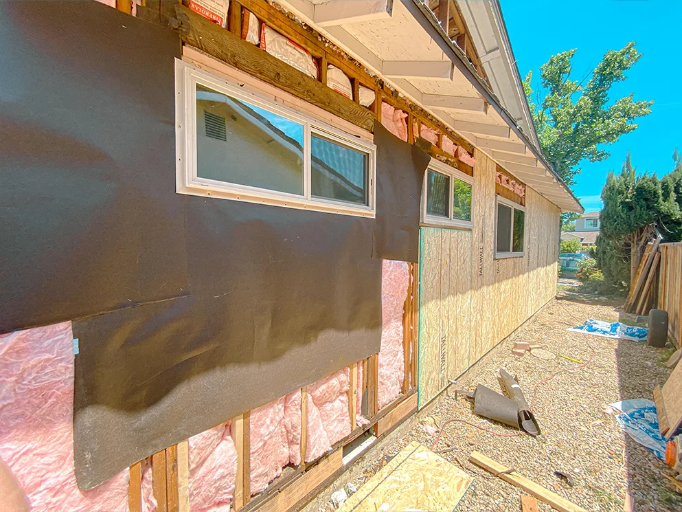 Weather resistive barrier going on over sheathing around the windows