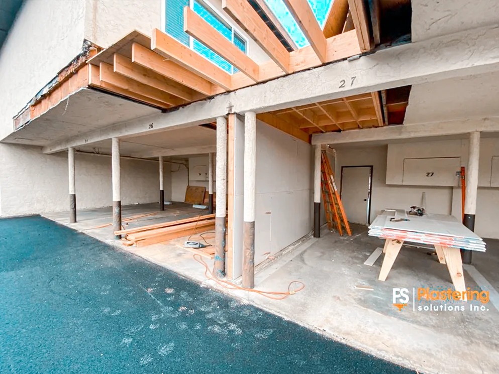 New carport framing between apartment garages