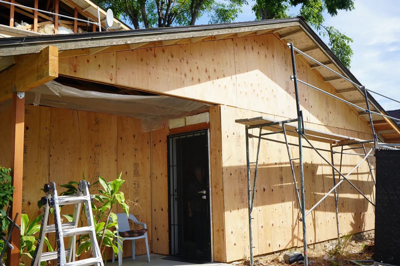 Apartment wall covered in new plywood shear wall sheathing before stucco