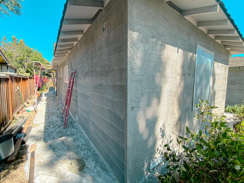 Scratch coat along the side walls with windows masked