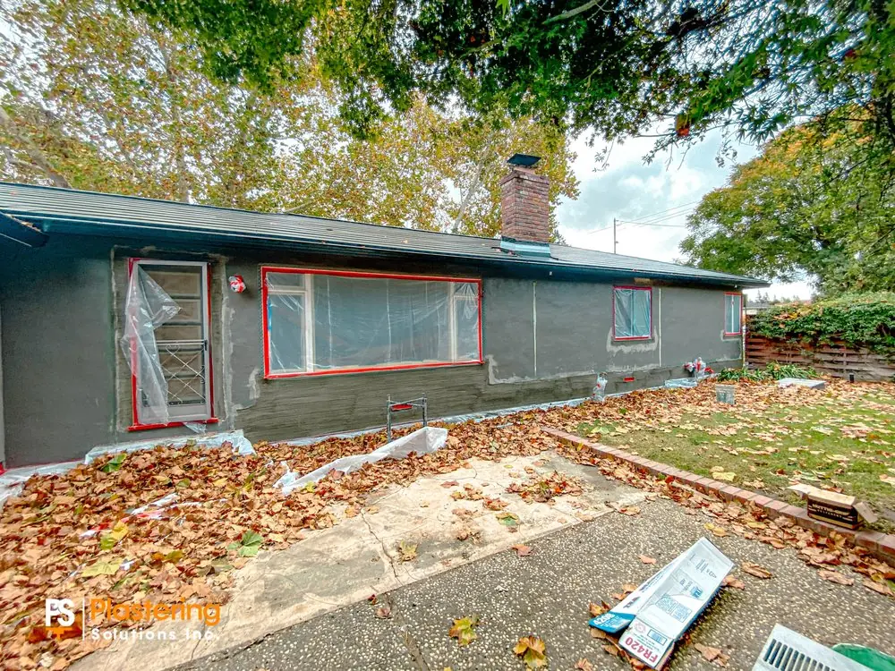 Rear wall with the brown coat applied and windows masked for protection